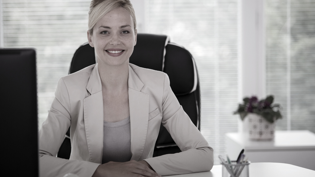 Professional woman sitting behind desk